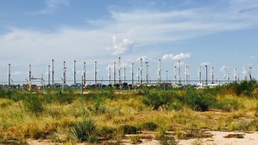 Nearly 40 inactive rigs are stored in a business park in Midland, Texas.